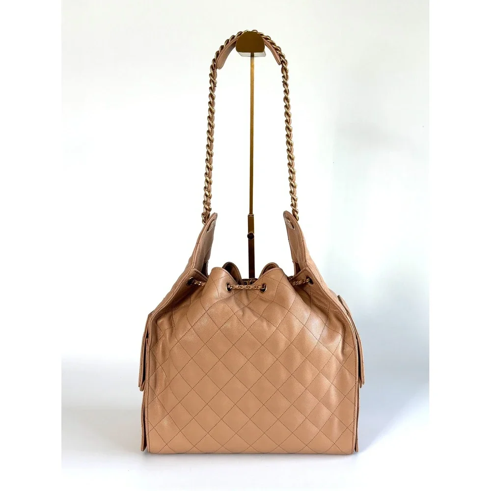 Chanel 25 Quilted Caviar Leather Beige Gold Hardware Drawstring CC, medium siz